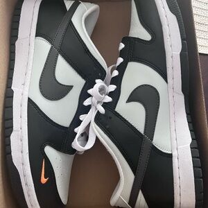 Nike Black and White Sneakers with Orange Accent